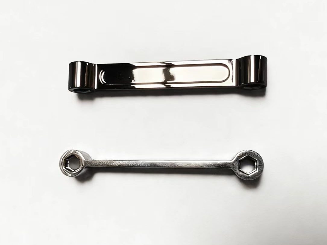 Electroplated zinc alloy support arm with machined pivot bores